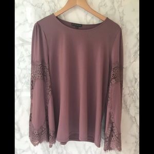 Long sleeve blush blouse with lace on arms.